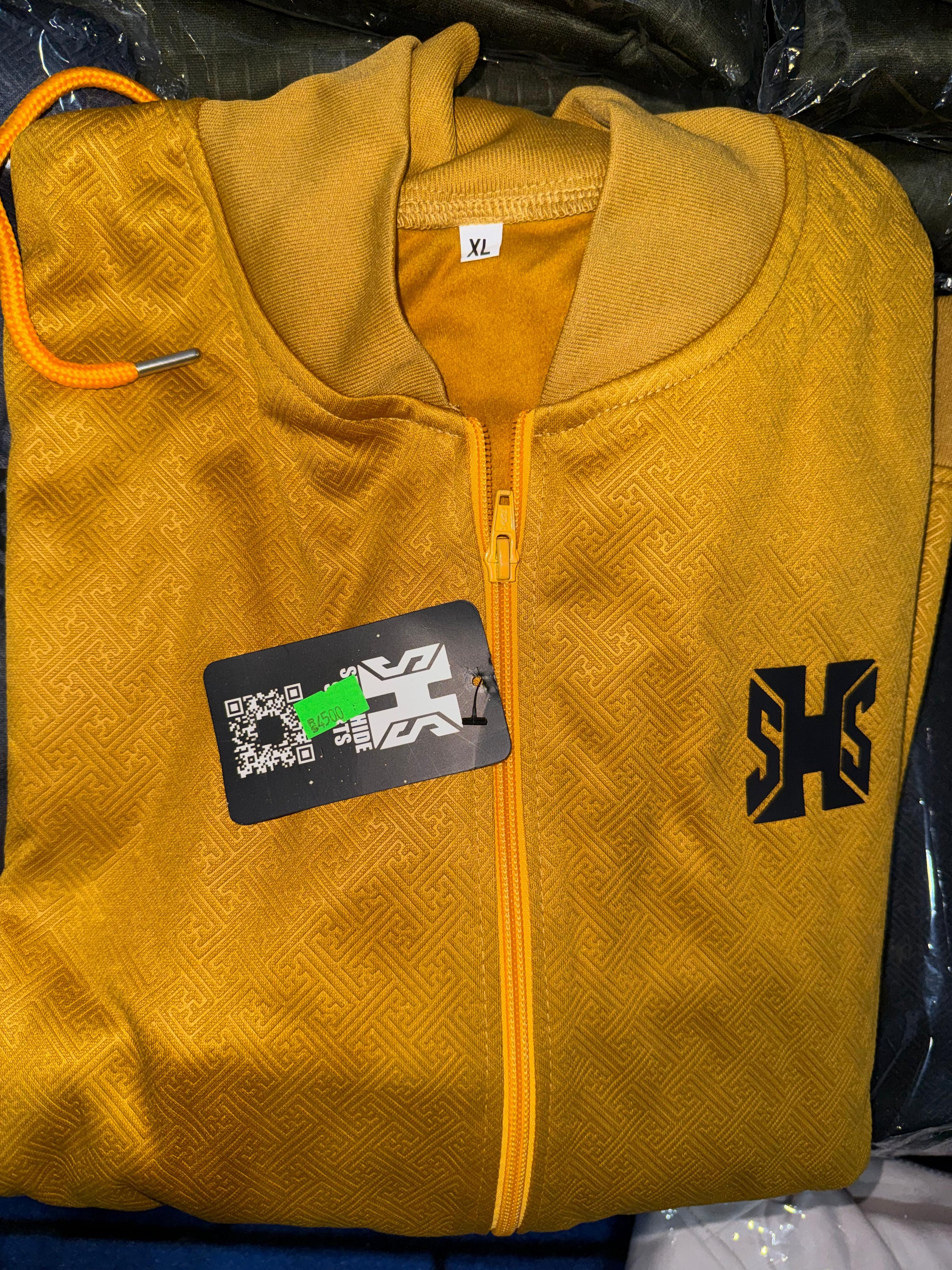 Yellow upper with a brand tag of Steel Hide Sports and logo on a black background
